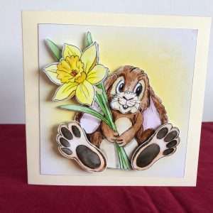 Image of decoupage bunny holding a daffodil