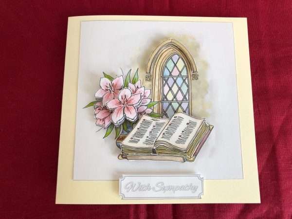 Church window with bible and flowers