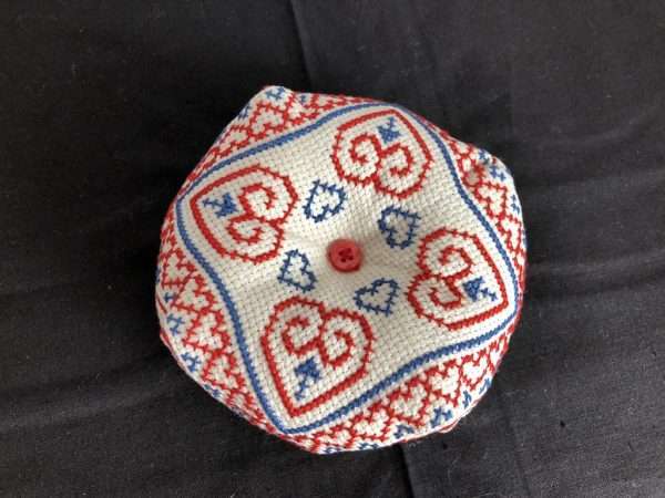 Biscornu Pincushion with red/blue pattern of heart shapes