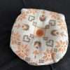 Biscornu pincushion orange/brown pattern