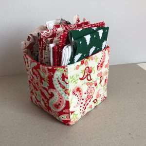 Fabric box in shades of red with fat quarters inside