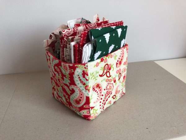 Fabric box in shades of red with fat quarters inside