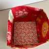 Shades of red fabric storage box showing inside