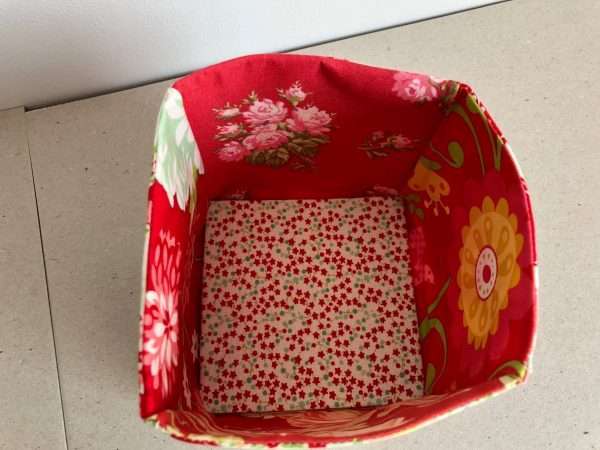 Shades of red fabric storage box showing inside