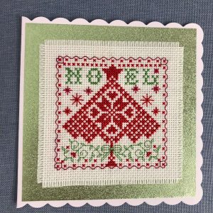 Christmas card with cross stitched Noel and tree