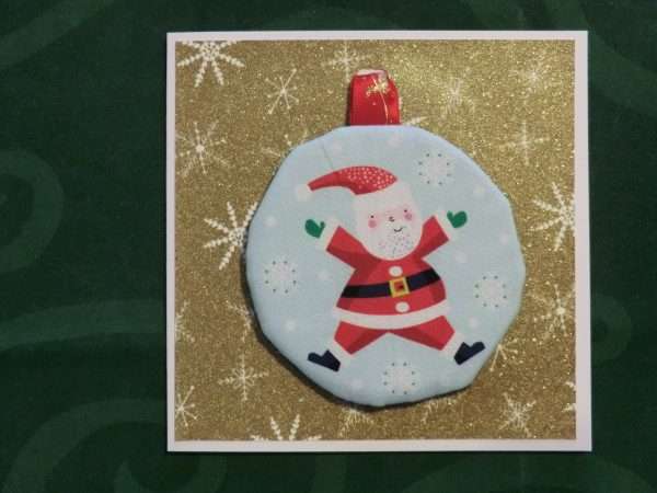 Card with Santa doing star jump