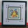 Pear in cross stitch with blue surround and frame