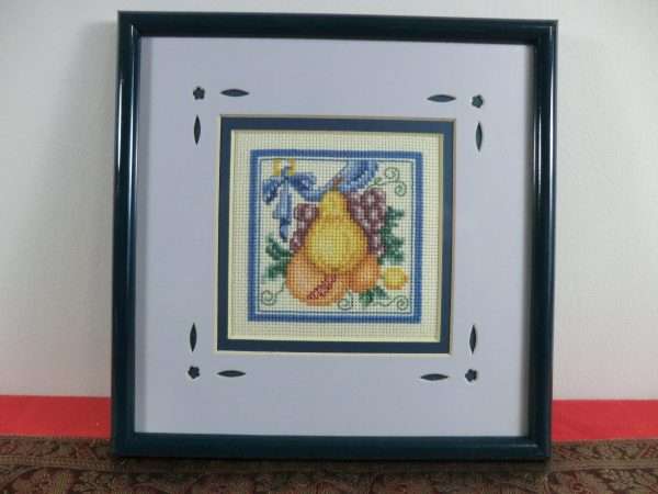 Pear in cross stitch with blue surround and frame