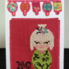 White Kokeshi doll card standing