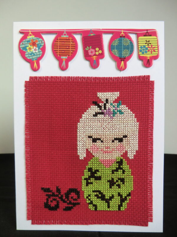 White Kokeshi doll card standing