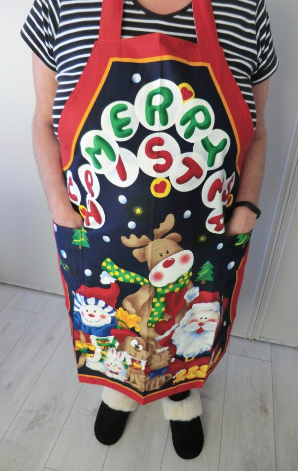 Christmas apron showing pockets in use