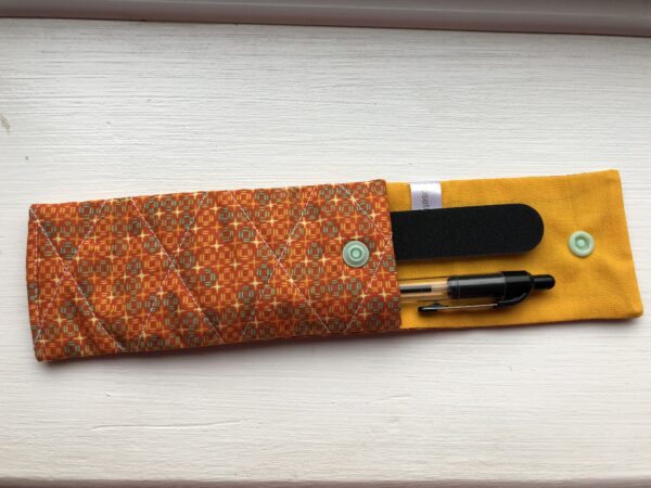 pen/nail file holder with contents