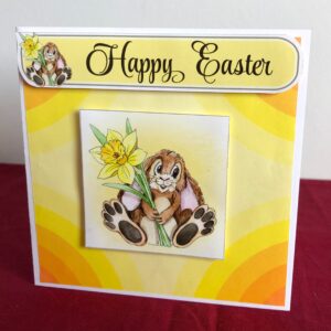 Easter card standing with an easter bunny holding a daffodil