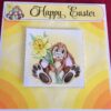 Decoupage card of Easter bunny with a daffodil in its hand