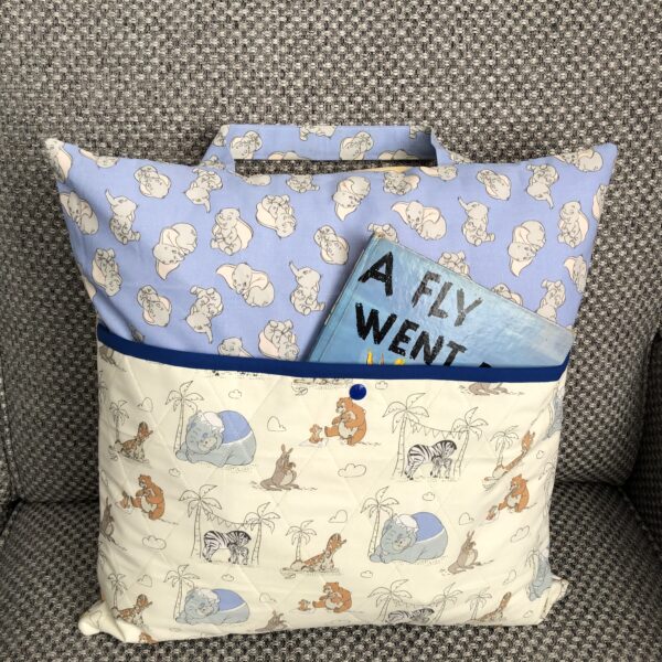 reading cushion in Dumbo and friends fabric with a quilted pocket on front