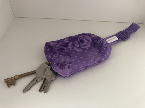 purple floral key holder with keys