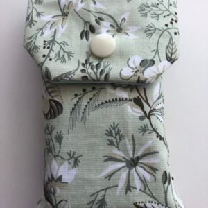 Pale green floral tissue cover with press stud closure