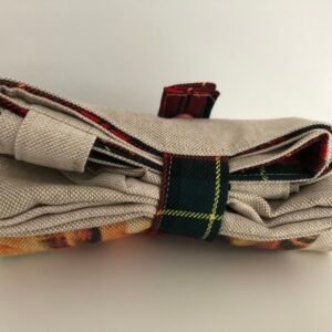 folding bag folded up and closed with strap and press stud