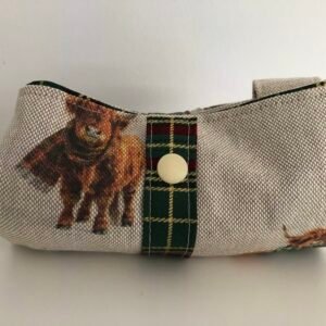Folded bag with strap and press stud