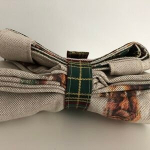 Folded bag closed with strap and press stud