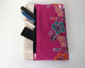 Notebook front pocket showing contents, pen, ruler, pencil