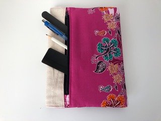Notebook front pocket showing contents, pen, ruler, pencil