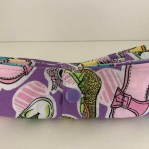 Shoe themed bag folded up showing purple press stud