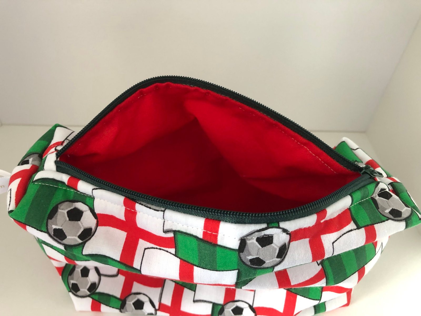 inside of England football pouch showing red lining fabric