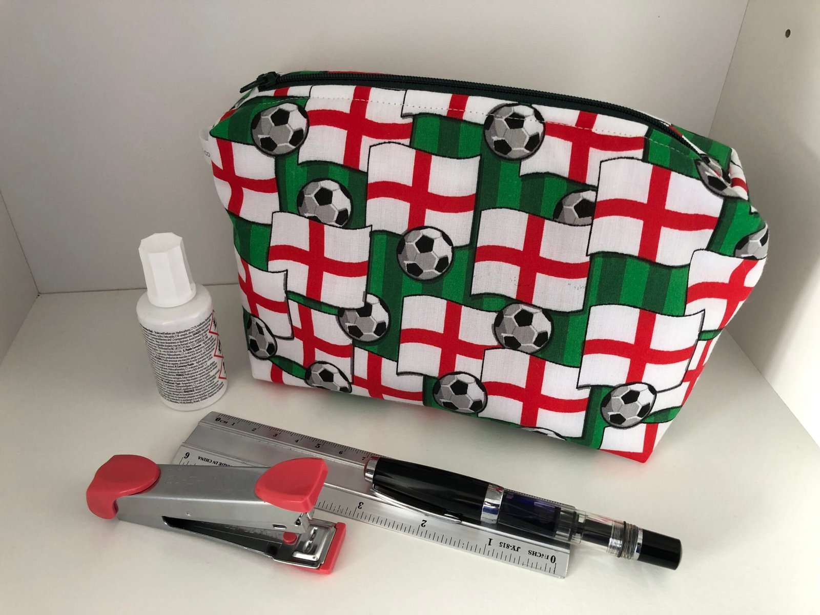 front of England football pouch showing a selection of stationery but this is not included.